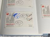 a lot of stamps on the pages of a book