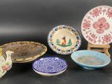 many different types of dishes and bowls on the table