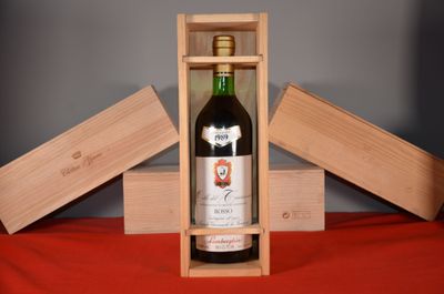 a bottle of wine in a wooden box on a table