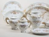 many pieces of porcelain on display on the table