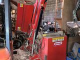 a forklift that is sitting in a garage