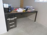 an image of a desk with a lot of clutter on it