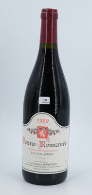 a bottle of wine that is sitting on a table
