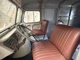 a view of the inside of a bus from the driver ' s seat