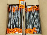 two boxes filled with screws and nails sitting on top of a floor