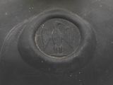 a black vase that has a monogram on it