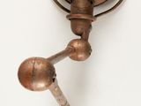 a metal object that is hanging on the wall