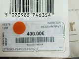 a person holding a card with a barcode on it