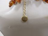 gold plated bracelet with a charm that says ' be brave ' on it