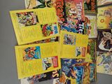 a lot of comic books that are on the table