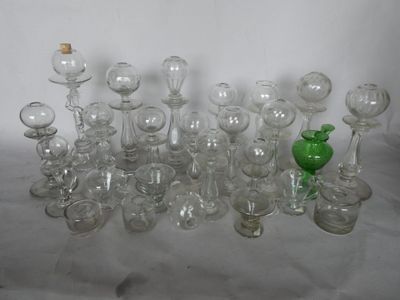 a lot of glass vases that are sitting on a table