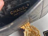 chanel shoes with a gold medallion on the bottom of the shoe