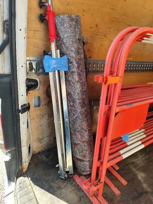 a red bench in the back of a moving truck