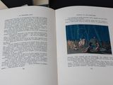 an open book with a picture of a group of people on it