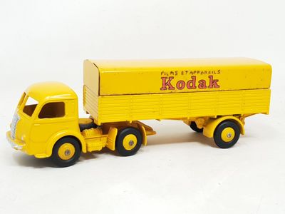 a yellow toy truck with a box on the back of it