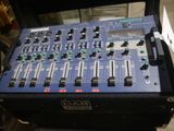 a close up of a mixer in a case on a table