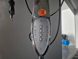 a close up of a remote control in a room