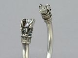 silver ring with a cat on the top of it and a cat on the bottom of the ring