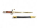 an image of a knife and a pen sitting next to each other