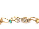 six different types of rings on a white surface