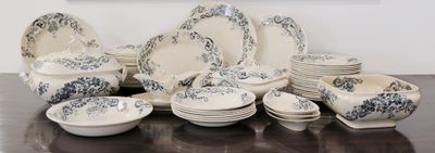 a lot of plates and bowls on the table
