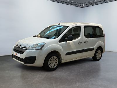 the white van is parked in a large room with white walls