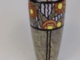 a vase with a design on it on a white surface