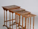 three wooden nesting tables with painted tops and legs