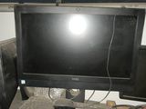 a desktop computer sitting on top of a wooden desk