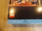 a box of legos sitting on a wooden table