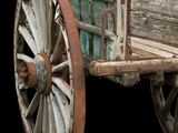 an old wooden wagon with a wooden seat on a black background