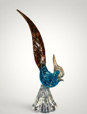 an image of a glass sculpture of a bird on a clear base