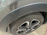 a close up of a car ' s tire on the street