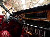a dashboard and steering wheel of a car in a garage