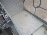 a close up view of a metal gate with a metal latch