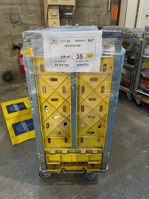 a cart that has a sign on it in a warehouse
