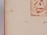 an old book with a drawing of a nude woman on it