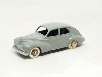 a toy car that is sitting on a white surface