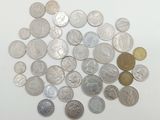 a lot of coins that are on the table