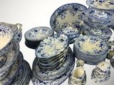 a lot of blue and white plates and bowls