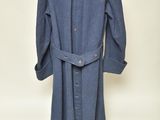 an image of a blue coat on a mannequin stand