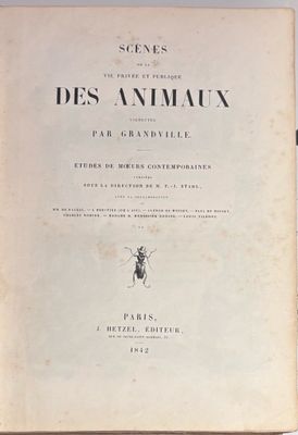 an old book with a bug on it sitting on a table