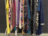 a rack of clothes that is hanging on a rack
