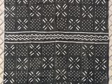 a black and white blanket with a pattern on it