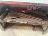 an image of a pile of wood on a workbench