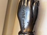 a statue of a hand that is on the wall