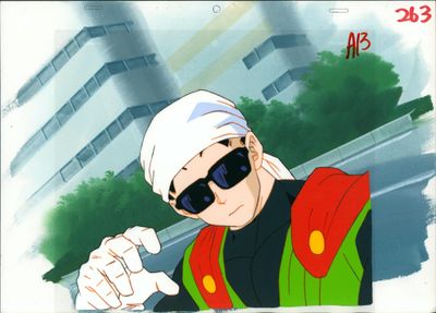 une image représentant un homme portant des lunettes de soleil et un bandana, qui montre quelque chose du doigt