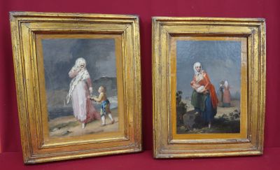deux tableaux encadrés représentant une femme et un enfant sur fond rouge