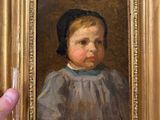 a painting of a little girl in a gold frame