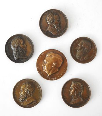 six different types of bronze coins on a white surface